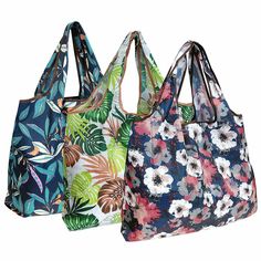 three bags with different designs on them, one is blue and the other has pink flowers