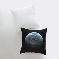 a black pillow with the earth on it