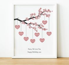 a pink cherry blossom tree with hearts hanging from it's branches and the words namma, we love you happy birthday xox