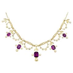 A stunning antique Edwardian 4.47 carat amethyst and seed pearl, 15 karat yellow gold necklace; part of our diverse antique jewellery and estate jewelry collections. This stunning, fine and impressive antique Edwardian amethyst necklace has been crafted in 15k yellow gold. The feature setting is ornamented with five floriated drop settings, each displaying a collet set emerald cut amethyst, totalling 4.47cts. Each amethyst setting incorporates three protruding collet set pearls, in addition to a Edwardian Necklace, Seed Necklace, Amethyst Set, Edwardian Jewelry, Diamond Necklace Set, Yellow Gold Necklace, Antique Necklace, Seed Pearl, Victorian Jewelry