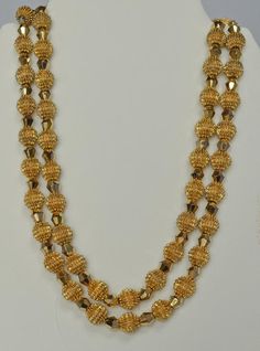 Alfred Philippe was Crown Trifari's Chief Designer from 1930 until 1968.  This exquisite necklace and earrings set was introduced during that time period and became referred to simply as the "Electra Collection".  The collection pieces utilized two innovative and striking types of beads.  The first type was the so called "Trifanium" spiked bead.  The second type was a gold plated crystal called an "Autrum" bead.  The intent of the Electra design was simply to "blow away" the competition--which i Double Strand Yellow Gold Jewelry With Beads, Yellow Gold Double Strand Jewelry With Gold Beads, Gold Double Strand Jewelry For Festive Occasions, Vintage 22k Gold Hallmarked Jewelry, Antique Round Jewelry With High Luster, Festive Double Strand Gold Necklace, Classic Gold Necklaces With Matching Earrings, Gold Plated Round Beads Jewelry For Formal Events, Gold Plated Round Beads Jewelry For Formal Occasions