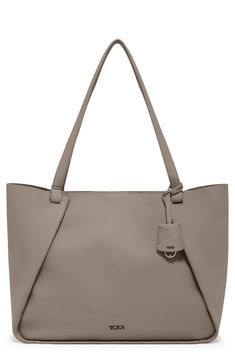 This elegant tote crafted from buttery-soft leather easily transitions from a day at the office to your weekend brunch plans. This bag includes Tumi Tracer®, an exclusive, complimentary program that helps reunite lost or stolen bags with their rightful owners using a one-of-a-kind 20-digit number affixed to the bag Unlined Leather Imported Elegant Taupe Shoulder Bag With Smooth Grain, Taupe Soft Leather Work Bags, Taupe Leather Bag With Smooth Grain, Modern Taupe Bag With Textured Leather, Taupe Smooth Grain Shoulder Bag, Timeless Taupe Leather Bag, Modern Taupe Textured Leather Bag, Taupe Modern Bag With Smooth Grain, Taupe Leather Bag With Handle Drop