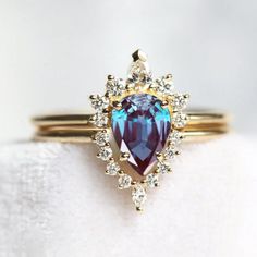 a close up of a ring with a blue stone