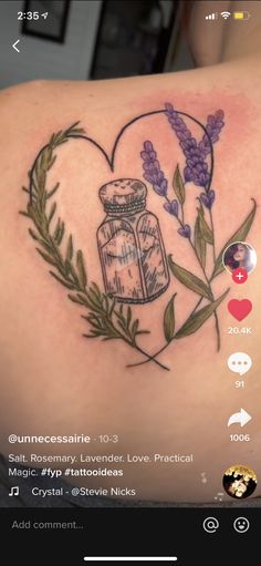 the back of a woman's shoulder with lavenders and a jar on it