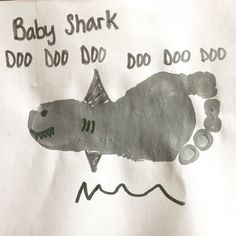 a child's drawing of a shark with words written on the bottom and below it