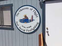 a sign on the side of a building that says the museum of flight