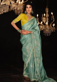 Sea green organza saree with blouse 5333  Desc:  Color : Sea Green Fabric : Organza Work : Embroidery Wash Care : Dry clean Sleeve Style : Half Sleeve Long Sleeves : Done only in Custom Stitch Sleeves Lining : Done only in Custom Stitch Bust Size : 32 to 42 Inches Occasion : Festival   Diwali   Mehendi   Ceremonial   Vat Purnima   Raksha Bandhan   Karwa Chauth   Ugadi. With Express Free Shipping and Custom Stitching, Buy Designer Sarees - Indian Party wedding and bridal  Sea green organza saree with blouse 5333 online in USA, UK and Canada from KollyBollyEthnics.com Organza Silk Saree, Heavy Work, Designer Sarees Online, Green Saree, Madhuri Dixit, Blue Saree, Trendy Sarees, Contrast Blouse, Embroidered Wedding