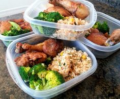 three plastic containers filled with food on top of a counter