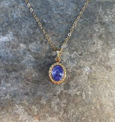 This necklace is handcrafted with an authentic 6x8mm tanzanite stone in a gold setting. The stone is AAA quality. The chain is 14k gold-filled and will not tarnish easily.  This necklace is hypoallergenic. (Cadium free, lead free, and nickel safe) Tanzanite is a calming stone that enhances intuition and compassion. Please note that each stone is unique and varies in color. Each necklace comes in a ribbon-wrapped box, ready to be gifted. If you would like to leave a note for the recipient, you can do so during checkout. Tanzanite Necklace, Tanzanite Stone, Calming Stones, Crystal Necklace, You Can Do, Necklace Etsy, Gold Filled, Jewelry Necklaces, Ribbon