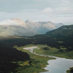 an aerial view of mountains and rivers in the wilderness