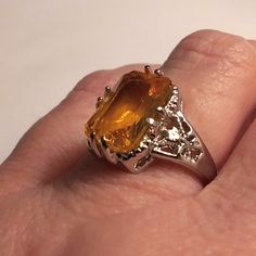 This Stunning Edwardian Victorian Vintage Mid-Century Avant-Garde Bohemian Gothic Celtic Style Ring Is A Show Stopper. 925 Sterling Silver. Size 8 4 Carats Of Citrine Stones. Citrine Is Associated With Positivity And Optimism, Which Is Not Surprising Given Its Cheerful Color. It's Often Used To Assist In Manifesting Financial Abundance And Opportunities. It Can Also Be Used To Awaken The Solar Plexus Chakra, Helping To Cultivate Confidence And Personal Power. 100% Authentic Stones, 925 Sterling Elegant Amber Topaz Ring, White Gold Citrine Jewelry With Accent Stones, Emerald Cut Citrine Rings, Elegant Amber Rings With Gemstone Accents, Wedding Silver Topaz Gemstones, Silver Citrine Jewelry With Accent Stones, Luxury Silver Topaz Ring With Citrine, Silver Citrine Topaz Ring With Prong Setting, Silver Gemstone Ring With Prong Setting