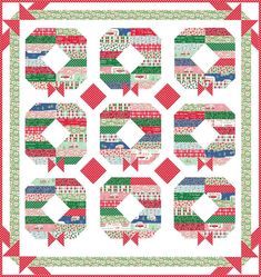 a red and green quilt with arrows on it