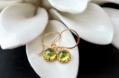 "8mm rose cut, lab created Peridot in an intricate crown bezel setting are suspended from luxe handmade French hooks. Available in your choice of 14k yellow gold fill, rose gold fill, or sterling silver. The gold filled options include premium plated bezels.  :: FIT :: Earrings measure just under 1.5\" in length, including the ear wire. :: RUSH MY ORDER :: 2-day rush processing is available for an additional fee. Use the shipping dropdown menu at checkout to select one of the RUSH options. You o Elegant Peridot Jewelry With Prong Setting, Elegant Peridot Birthstone Earrings, Elegant Peridot Earrings For Anniversary, Elegant Peridot Earrings For Wedding, Royal Earrings, Birthday Jewelry, Peridot Earrings, August Birthstone, Birthday Jewelry Gift