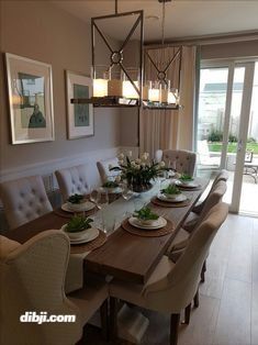 the dining room table is set with dishes and place settings for eight people to eat