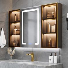 a bathroom with a sink, mirror and lights on the wall above it's cabinets