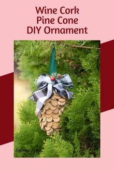 wine cork pine cone diy ornament hanging from a tree with blue ribbon