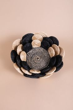 a black and white basket sitting on top of a table