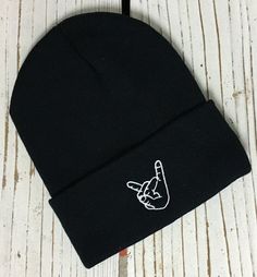 ROCK ON HAND Embroidered Beanie Cuffed Cap - Multiple Colors ✷ Cuffed Beanie with Embroidered Rock On Hand Sign ✷ Choose Color from Drop Down Menu ✷ One Size fits all ✷ 100% Acrylic ✷ Great fit and soft quality - Guaranteed! ✷ Still don't see the color combination you want? Just ask we can usually make it for you :) ✷ Shipping from Long Beach, CA ✷ Embroidered here at The One Stop Outlet ✷ If you have any questions or concerns please feel free to send us a message! ✷ Have a design idea of your o Rock On Hand Sign, Rock On Hand, Beanies For Men, Beanies For Women, Beanie Outfit, Rock Hand, Motivational Quotes Wallpaper, Embroidered Beanie, Hand Sign