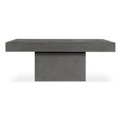 a concrete table with a square base on the top, and a rectangular shape at the bottom