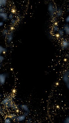 a black background with gold stars and sparkles