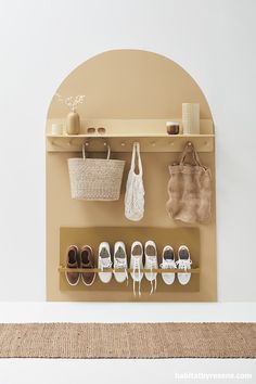 there is a shelf with shoes and bags on it