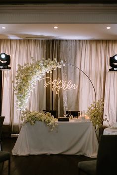 a table with flowers and candles on it