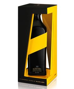 a bottle of black and yellow wine in a cardboard box with the lid open to reveal it's packaging