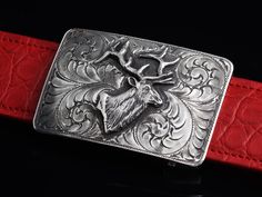 The Mesa Elk by Comstock Heritage is a Sterling silver "Mesa" shape square buckle featuring hand engraving around a hand cast Sterling silver elk figure. Measures 2" x 3" Fits up to a 1 ½" belt strap Alligator Belt, Ostrich Legs, Leg Belt, Elk, Hand Cast, Hand Engraving, Belt Buckles, Calf Skin, Buckle