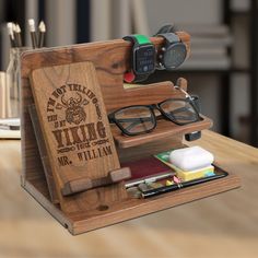 a wooden case with glasses and other items in it