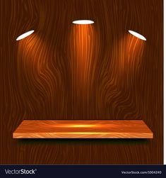 three spotlights on a wooden shelf in the dark