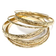 Our 7 days bangles set is make with 14k gold filled wire. Bangle is hand- formed, hammered into a faceted design and polished for a stunning texture and shine. It looks great worn alone or stack with other shell and charm bangles to create a chic, fun beachy look. This set come with 3 heirloom bangles and 4 faceted textures bangles. Each bangle is custom made to order so can not be return or exchange for that reason. Please indicate your bangle size at checkout. If you do not know your size form Hawaiian Bangles, Golden Bangles, Bangle Stack, Xoxo Jewelry, Jewellery Bangles, Dope Jewelry Accessories, Indian Bangles, Gold Bangle Set, Charm Bangles