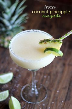 a frozen coconut pineapple margarita is garnished with an avocado