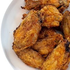 fried chicken pieces on a white plate ready to be eaten