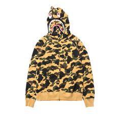 Find BAPE 1st Camo Shark Full Zip Hoodie on Editorialist. Rendered in an allover camouflage print, the BAPE 1st CAMO Shark Full Zip Hoodie 'Yellow' from SS20 features the brand's iconic shark-face motif on the hood and a full-extension zip. Yellow Zip Up Hoodie, Yellow Camo, Shark Head, Camouflage Design, Zip Up Hoodie, Full Zip Hoodie, Zip Hoodie, Camouflage, Camo