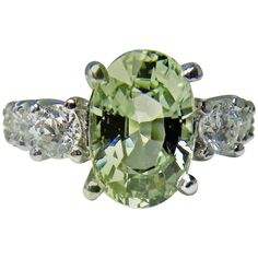 EGL USA Certified 4.38cts Natural Untreated Fine Sapphire and Diamond Engagement Wedding Ring 18k White Gold Primary Stones: Natural Sapphire Shape or Cut : Oval Faceted Cut Average Color/Clarity : Fine Light Yellowish-Green / VVS Total Sapphire Weight : 3.78 carats (10.74 x 7.24 x 5.46 mm) Other Stone: Diamonds F-G/VS Approx. .60ct Ring Measurement:16.00mm x 11.00mm, rising 6.50mm above the finger! Total Gemstones Weight: 4.38 Carats Composition: Solid White Gold 18K Total Ring Weight: 4.7g Style: Solitaire w/accents - Classic/ Prong Setting Size: 7.5 Condition: Excellent Comments: 100% NATURAL - Untreated Guaranteed! Included EGL USA Certificate for the Sapphire! Sapphire And Diamond Engagement Ring, Engagement Ring On Hand, Blue Sapphire Diamond Ring, Green Sapphire Engagement, Fine Engagement Rings, Green Sapphire Engagement Ring, Sapphire Diamond Engagement, Contemporary Engagement Rings, Diamond Cluster Engagement Ring