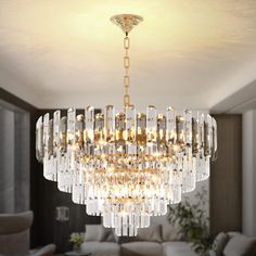 a chandelier hanging from the ceiling in a living room