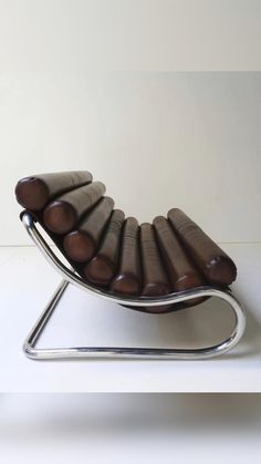 a chair made out of chocolates sitting on top of a white table