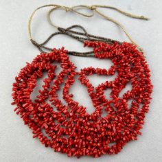 A long Santa Domingo 3 strand red coral and fine shell necklace. Guessing 1980's or 1990's. I've had them for awhile. 21 inches of coral times 3 strands shell is 6 inches. 8" braided cord on each side So - total length 45" at the max. 34" min. Multi-strand Red Coral Beaded Necklace As Gift, Multi-strand Red Coral Beaded Necklace For Gift, Handmade Multi-strand Red Coral Necklace, Multi-strand Red Coral Beaded Necklaces, Coral Multi-strand Beaded Necklaces, Coral Multi-strand Beaded Necklace, Coral Red Multi-strand Beaded Necklaces, Red Multi-strand Necklaces With Natural Stones, Handmade Multi-strand Red Coral Jewelry