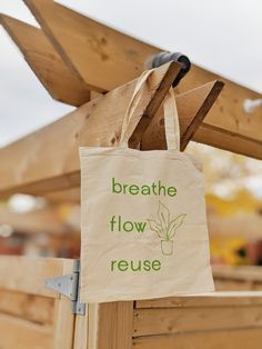 "Hello and welcome to my shop, Mads Flows Designs! ♥ PRODUCT DESCRIPTION ♥ This green \"Breathe Flow Reuse\" tote bag is lightweight, practical and durable. It's perfect for markets, shopping, and to hold anything you could think of! It's a great item to get for yourself, a group of people or as a gift for family and friends! ♥ KEY FEATURES ♥ * 100% Cotton sheeting * 15.75\"h x 15.25\"w, handle length 21.5\" * Lightweight & compact ♥ CARE INSTRUCTIONS ♥  * Remove all items from the bag before cleaning  * Suggested to pretreat visible stains with stain remover * Mix warm water with laundry detergent & clean bag with terry washcloth or soft bristle brush, let air dry *Note: Design is only on one side*" Eco-friendly Tote Bag For Personal Use, Rectangular Reusable Bag For Personal Use, Green Canvas Bag With Eco-friendly Ink As Gift, Eco-friendly Reusable Tote Bag, Eco-friendly Green Bags For Gifts, Recyclable Tote Canvas Bag For Gifts, Reusable Tote Shoulder Bag For Gifts, Eco-friendly Reusable Shoulder Bag, Green Recyclable Bags For Gifts