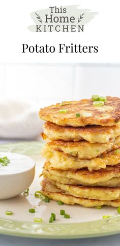 Stack of potato fritters on a plate next to a bowl of sour cream.