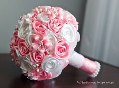 a bridal bouquet with pink and white flowers