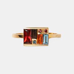 Beautifully stunning, this Deco-inspired ring features London blue topaz, citrine, red garnet, and smokey quartz. Shop online or in our Brooklyn store! Tea Towel Art, Mosaic Ring, Orange Citrine, Fog Linen, Blue Mosaic, Sky Color, Tangerine Orange, Geometric Lines, Fun At Work