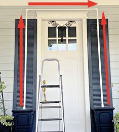 a step ladder sitting in front of a white door