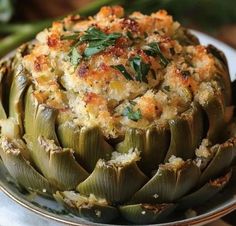 an artichoke dish is served on a plate