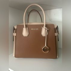 Brand New Michael Kors Handbag -Comes With Adjustable/Detachable Strap - Can For Up To A Small Laptop/ Ipad - Lots Of Storage - Never Used! Beige Rectangular Satchel With Branded Hardware, Designer Top Handle Bag In Neutral Color, Designer Neutral Top Handle Bag, Neutral Designer Top Handle Bag, Beige Travel Bag With Branded Hardware, Designer Rectangular Neutral Bags, Designer Neutral Rectangular Bags, Beige Satchel With Branded Hardware For Daily Use, Beige Bags With Branded Hardware And Double Handle