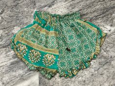 "Handmade Product Men's Silk Blend Boxer Shorts | Silk Short | Women Floral Paisley Silk Short | Boho Shorts | Sleep Bottoms Men | Beach Shorts | Gift for Her This sari silk short was made to look cool in summers, It is handmade with different patterns. It comes with comfortable elastic waist and ankle. These are made perfect for a relaxing day at home, working out, yoga. Made with sari silk fabric. Details - Size - Free size Fabric - Silk Waist - 20\" stretching to 40\" inch Hip - 30 to 46\" inch Length - 16 to 18\" inch Fit - Regular Pattern - Floral Color - Green Wash - Hand wash in cold water and hang dry in the shade." Green Festival Bottoms With Built-in Shorts, Green Printed Vacation Shorts, Festival Green Bottoms With Built-in Shorts, Bohemian Green Shorts For Beach, Green Summer Festival Shorts, Green Beachwear Shorts For Festivals, Green Festival Bottoms Short Length, Green Short Length Bottoms For Festival, Short Green Festival Bottoms