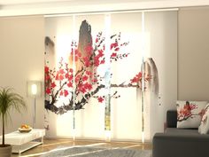 a living room with sliding glass doors decorated with red flowers