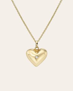 A 14K gold domed heart, studded with a sparkling diamond at its core and radiating with whimsical charm! Swingin' from a cute cable link chain, it's delightful little dazzler! Size: Approx. 14mm(W) x 13mm (H) Diamond Carat Weight: Approx. .02 ctw Total Weight: Approx. 2.5 grams Ships in 6-10 business days Rush orders ship in 4-7 business days *Eligible for return, per our policy. See here for details. Heart-shaped Diamond Charm Necklaces For Anniversary, Heart-shaped Diamond Charm Necklace For Anniversary, Gold Heart Necklace With Single Diamond, Gold Heart-shaped Diamond Charm Necklace, Gold Diamond Heart Charm Necklace, Gold Diamond Charm Necklace With Heart Charm, Valentine's Day Heart Necklace With Single Diamond, Tiny Diamond Necklace, Custom Jewelry Box