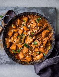 a pan filled with food on top of a table