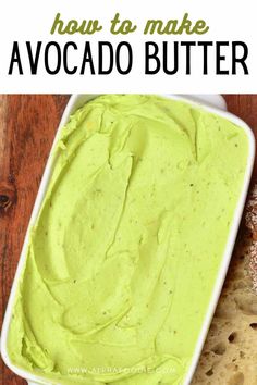 homemade avocado butter in a white dish with bread on the side